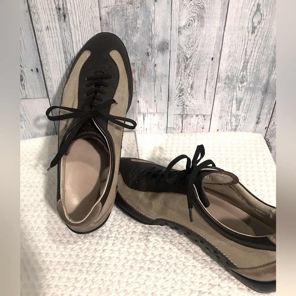 Tod’s tan and brown lace up luxury trainer.